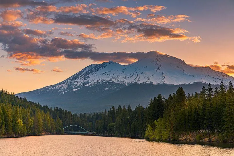 Sunset clouds over a mountain lake